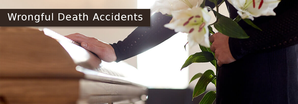 woman hand on casket holding flowers with caption Wrongful Death Accidents